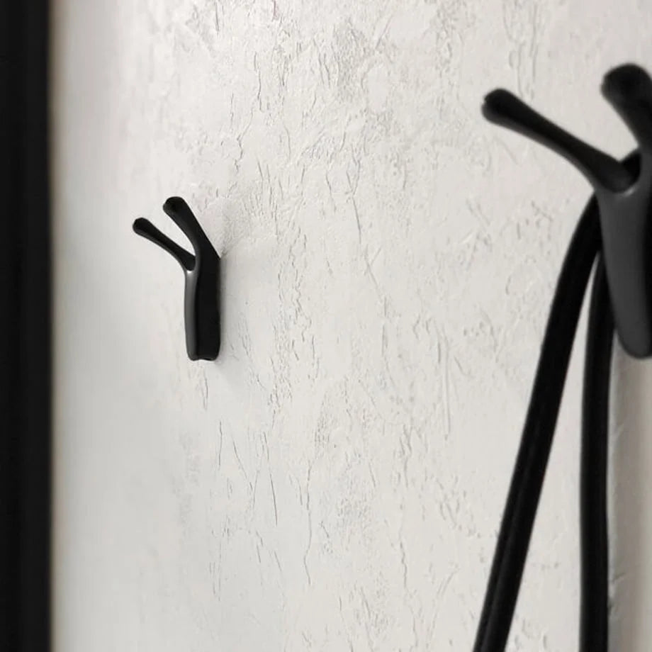 Variant Lifestyle: Side view of the black branch-shaped hooks, showing a bag handle looped over one - RoomDen