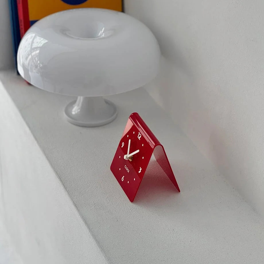 Angled view of the red minimalist table clock, showing its folded design. - RoomDen