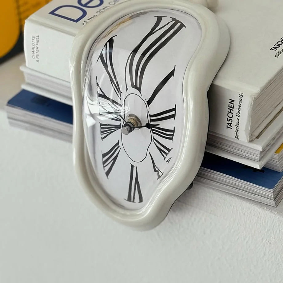 Detailed close-up of the white melting clock's distorted face and Roman numerals.
