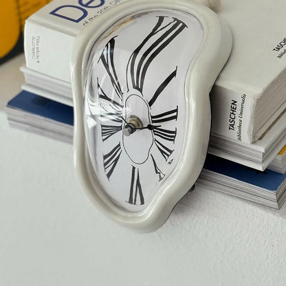 Detailed close-up of the white melting clock's distorted face and Roman numerals.