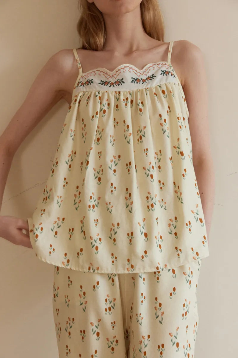 Close Up of Scalloped Embroidery and Cross Stitch Detail on Bodice - RoomDen