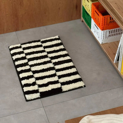 Angle view of the fluffy texture and graphic stripe design of the accent rug near storage crates - RoomDen