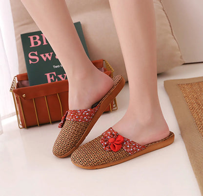 Side profile of Red Floral Natural Rattan House Slippers on model - RoomDen