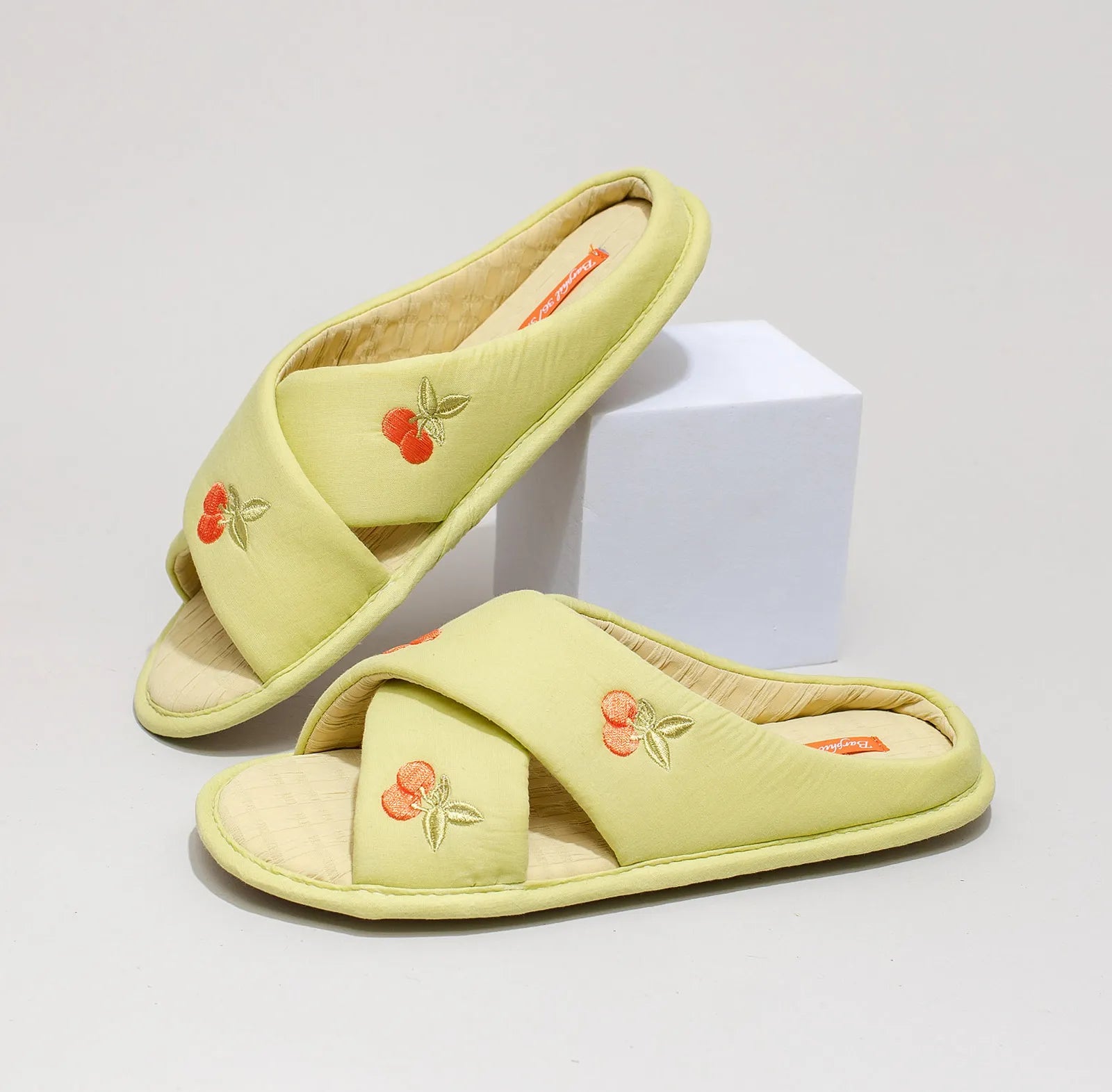 Green embroidered cherry slippers showing side profile and sole - RoomDen