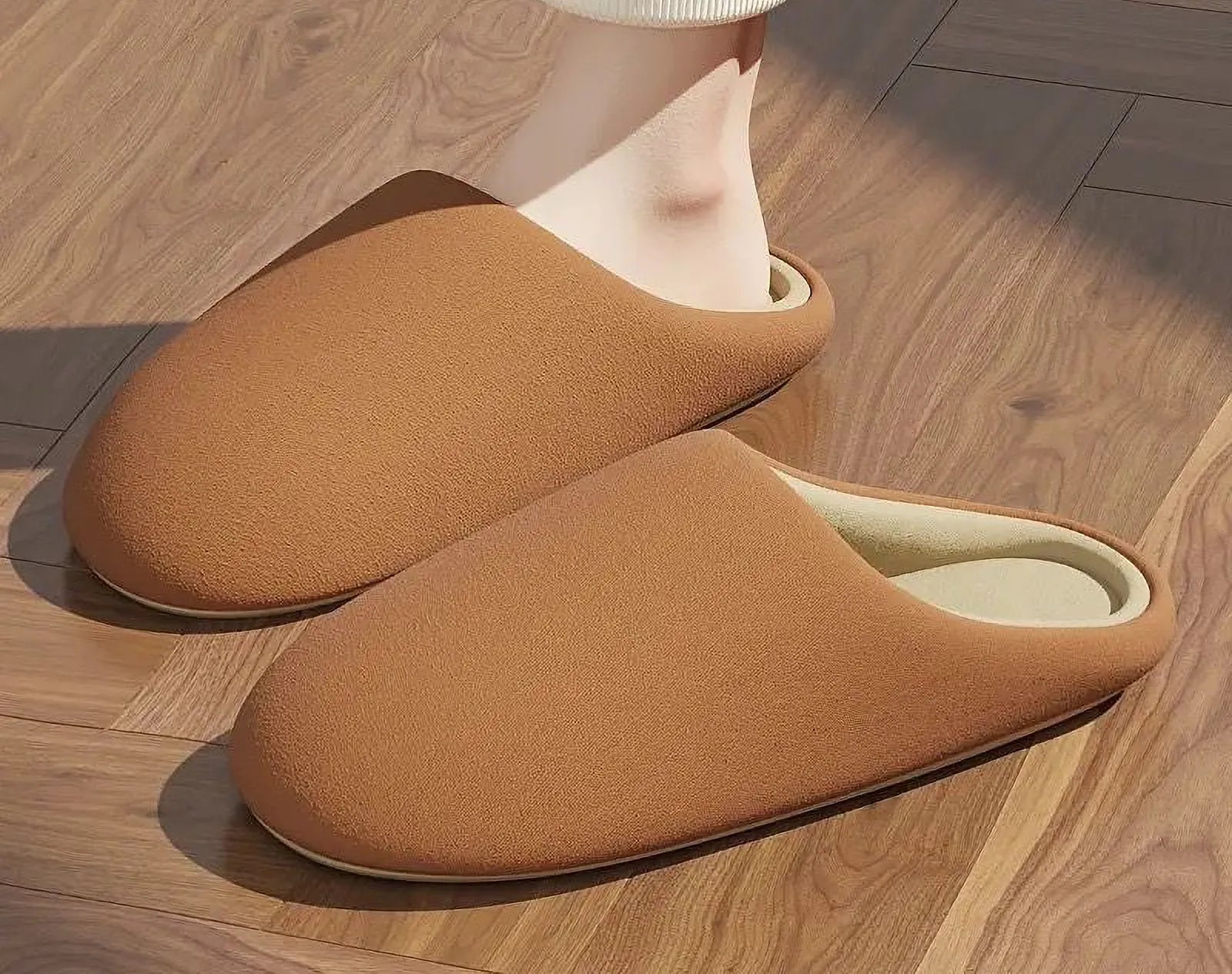 Orange plush cotton slippers on feet warm lighting - RoomDen