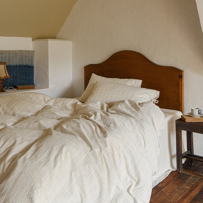 Ashfield Fine Color-Line Check Bedding Set – Fine checked bedding against a wooden headboard - Roomden