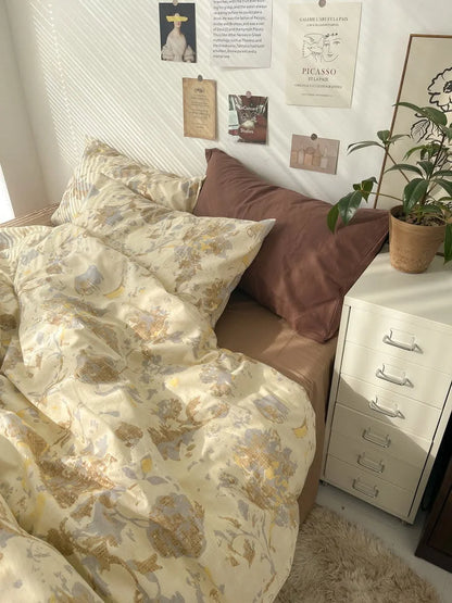 Close-up shot of the pillows on the vintage floral bedding, highlighting the abstract pattern and the deep brown accent pillow. - RoomDen