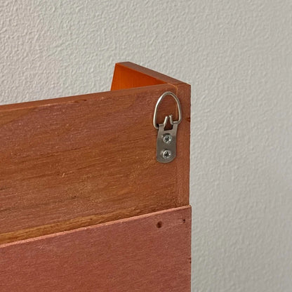 Close-up of the metal D-ring hanger on the back of the wood wall shelf for easy mounting - RoomDen