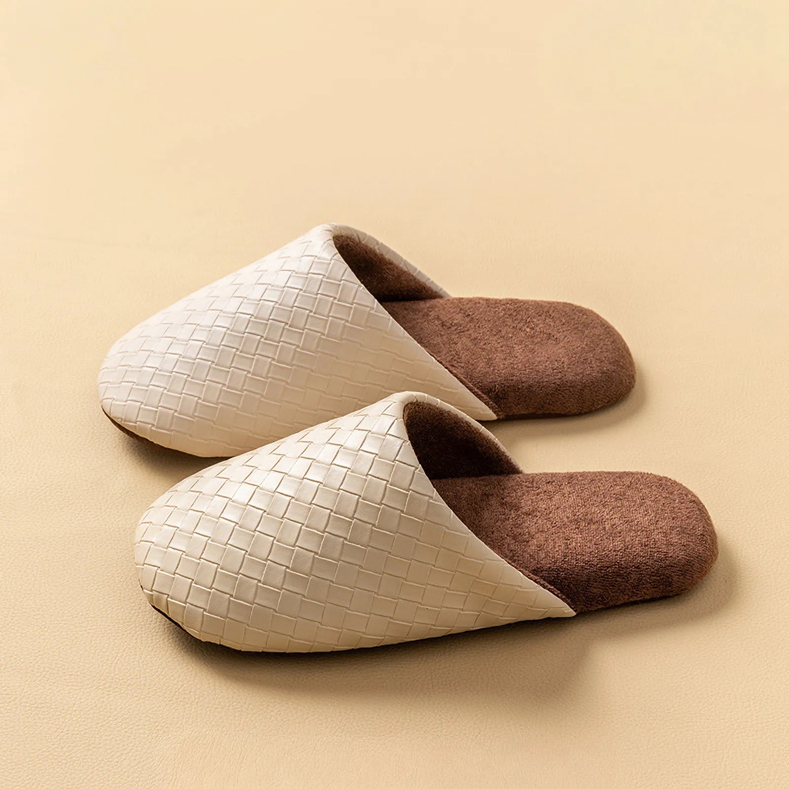 Side profile of beige woven plush slippers on a beige background - RoomDen