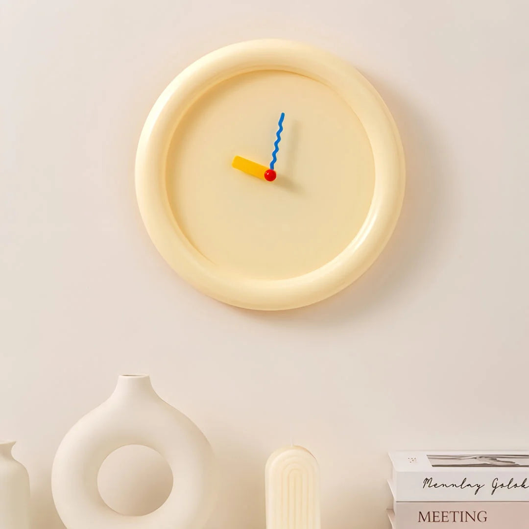 Creamy Beige Chunky Frame Wall Clock displayed on a wall over a desk setup - RoomDen
