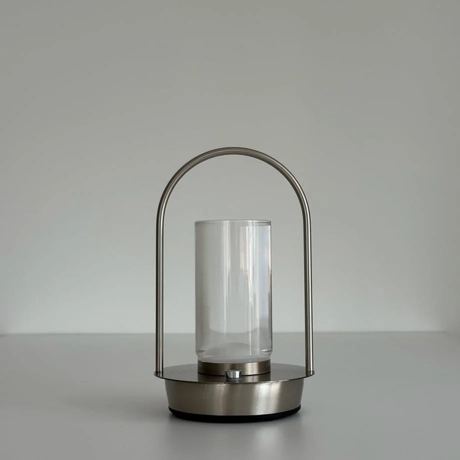 Front view of the Minimalist Arch Metal Portable Table Lamp against a white background, turned off. - RoomDen
