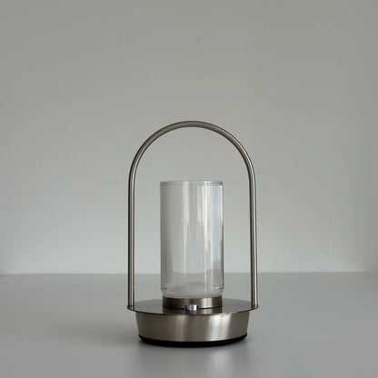 Front view of the Minimalist Arch Metal Portable Table Lamp against a white background, turned off. - RoomDen