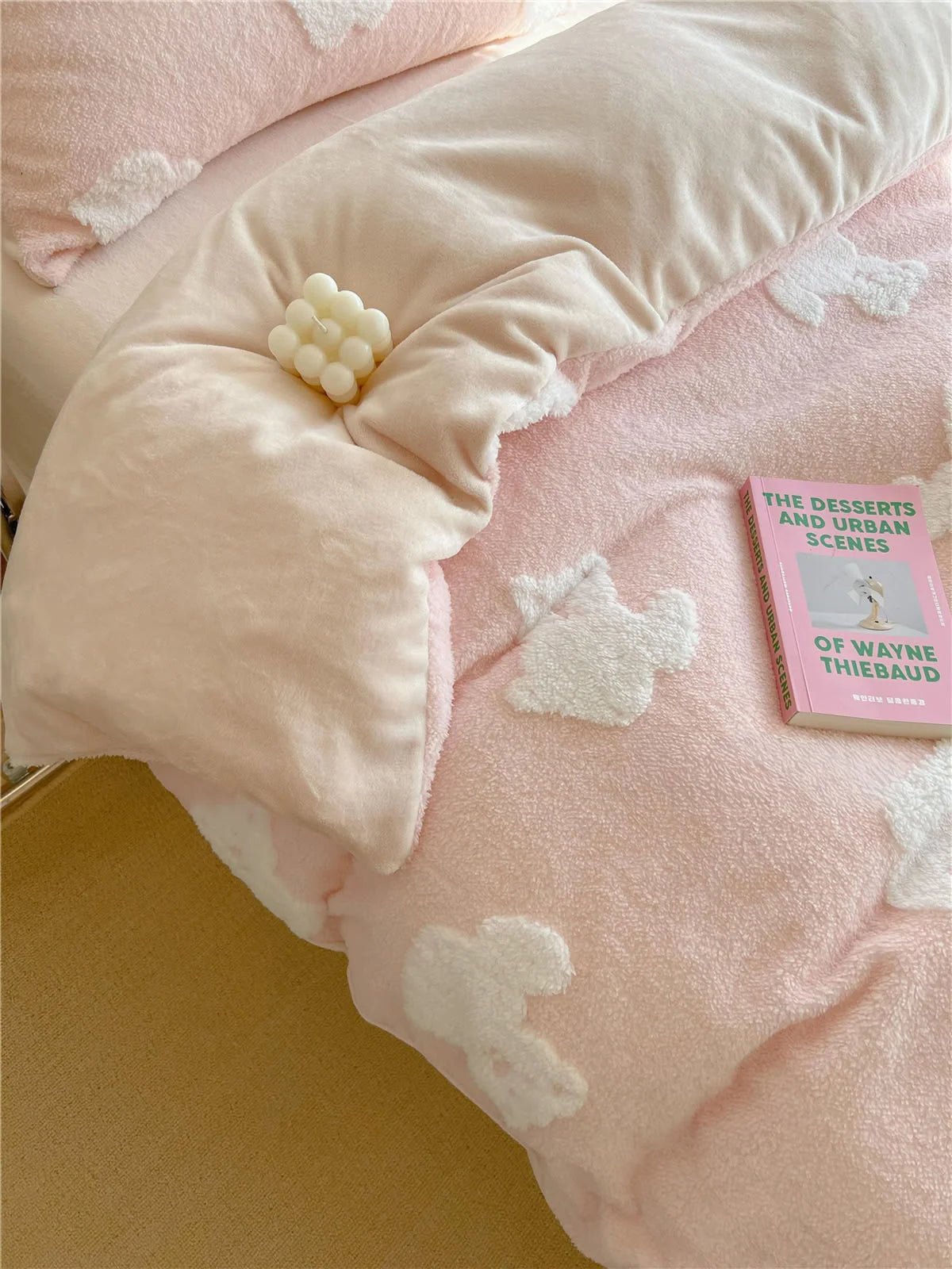 Detailed view of the pink teddy bear bedding with the duvet cover turned down to show the soft inner lining. - RoomDen