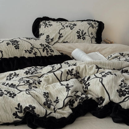 Another perspective of the full bedding set, emphasizing the cozy and rumpled texture of the duvet cover and pillows - RoomDen.
