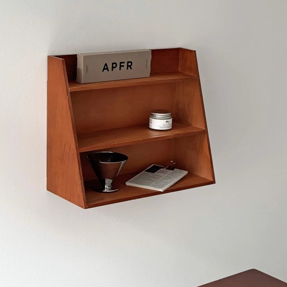 Front view of the Natural Grain Slanted Wood Wall Shelf in Cherry Wood - RoomDen