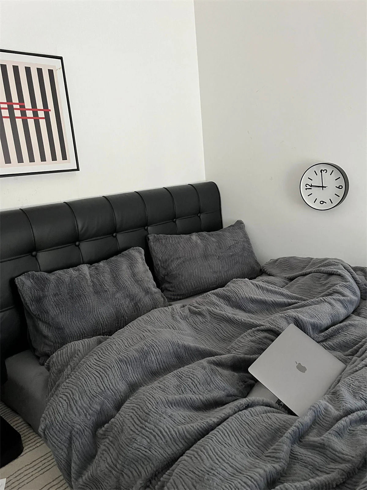 A sophisticated Charcoal Grey ruched flannel fleece bedding set against a black headboard. - RoomDen