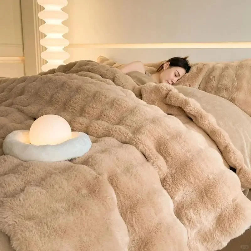 A person sleeping peacefully in the cozy Warm Beige plush bedding. - RoomDen
