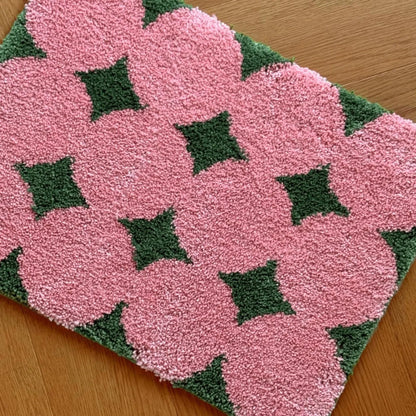 Close up texture detail of pink flower pattern rug - RoomDen