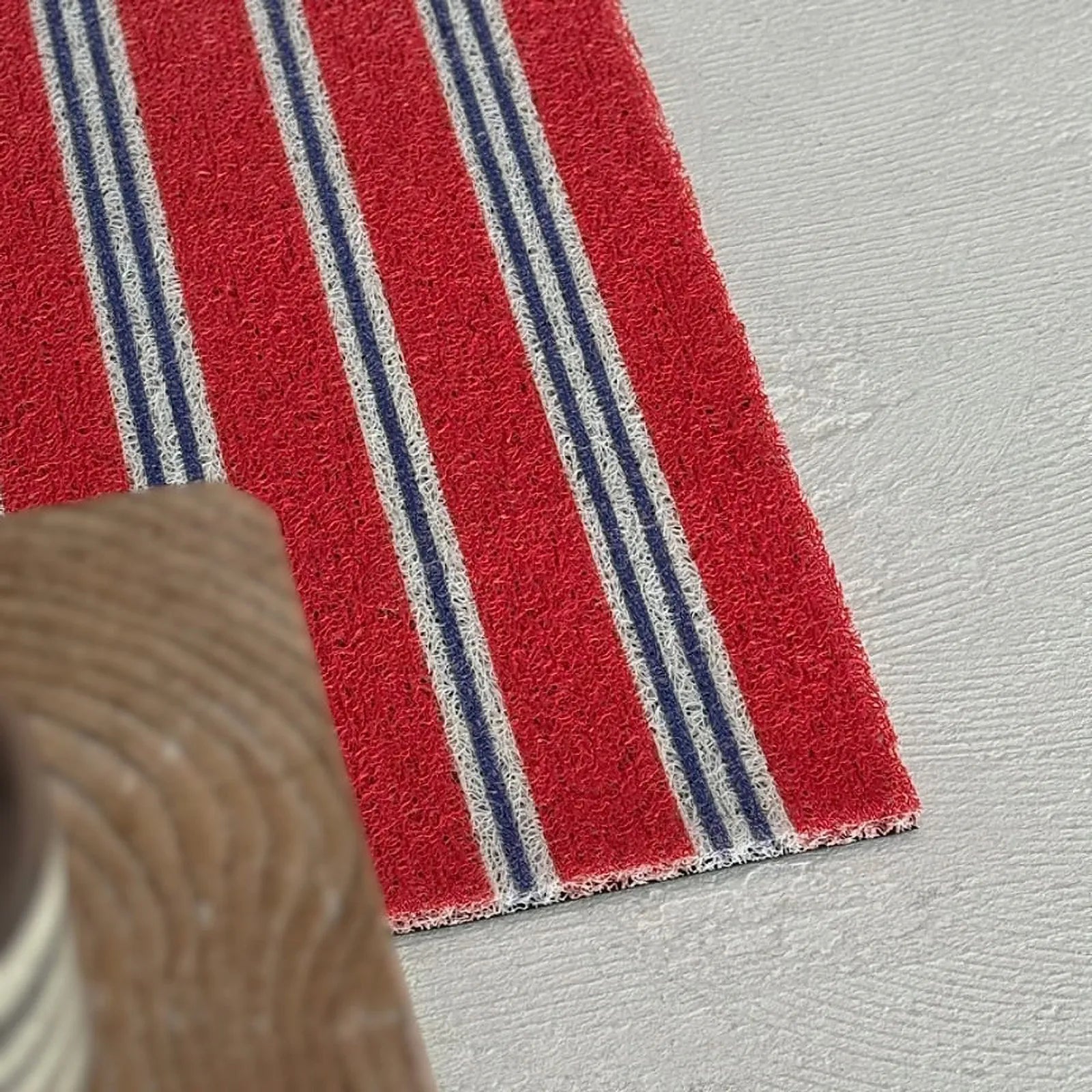 Top down view of Red Striped PVC mat texture - RoomDen