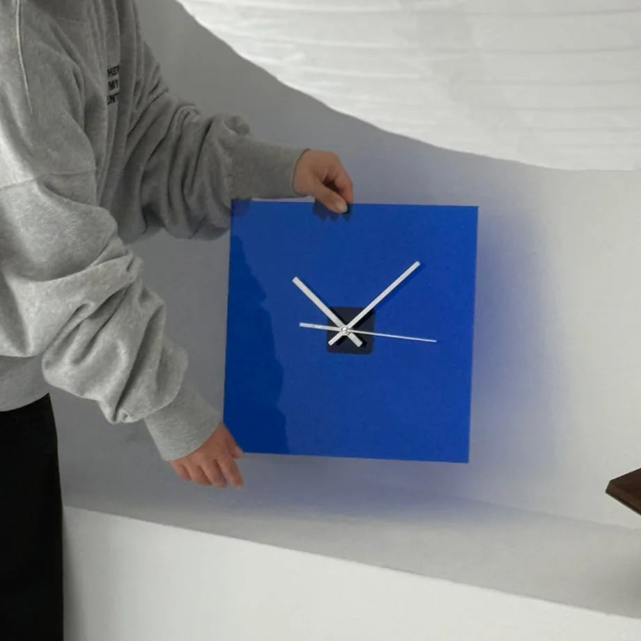 Placing the Cobalt Blue square acrylic clock against a white wall. - RoomDen
