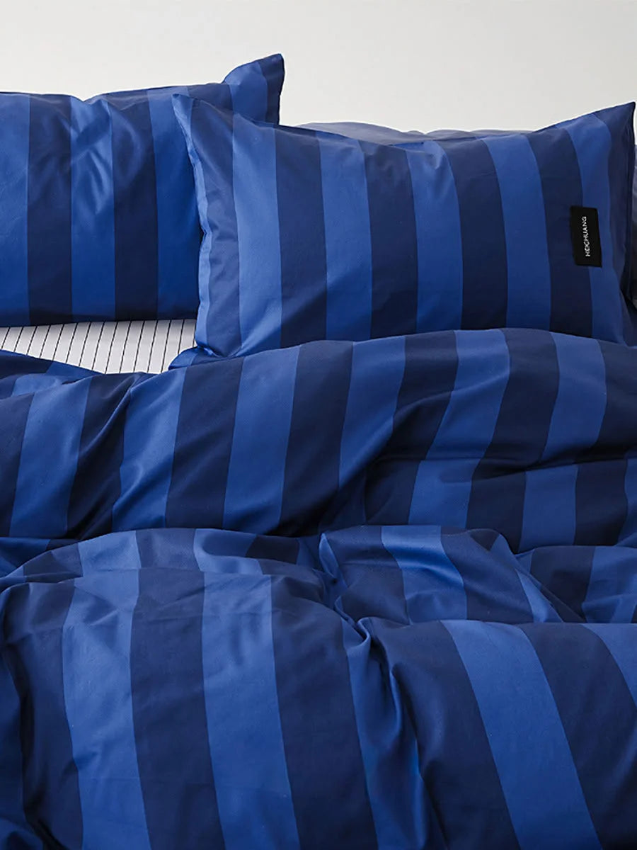 Close up of Navy & Blue Striped pillowcase showing brand tag - RoomDen