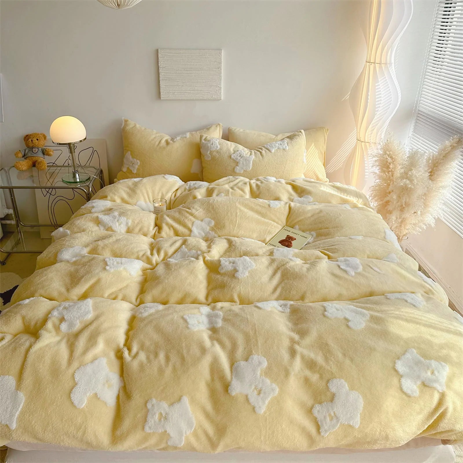 A cozy bedroom scene featuring the yellow teddy bear flannel fleece bedding, with a small teddy bear on the nightstand. - RoomDen