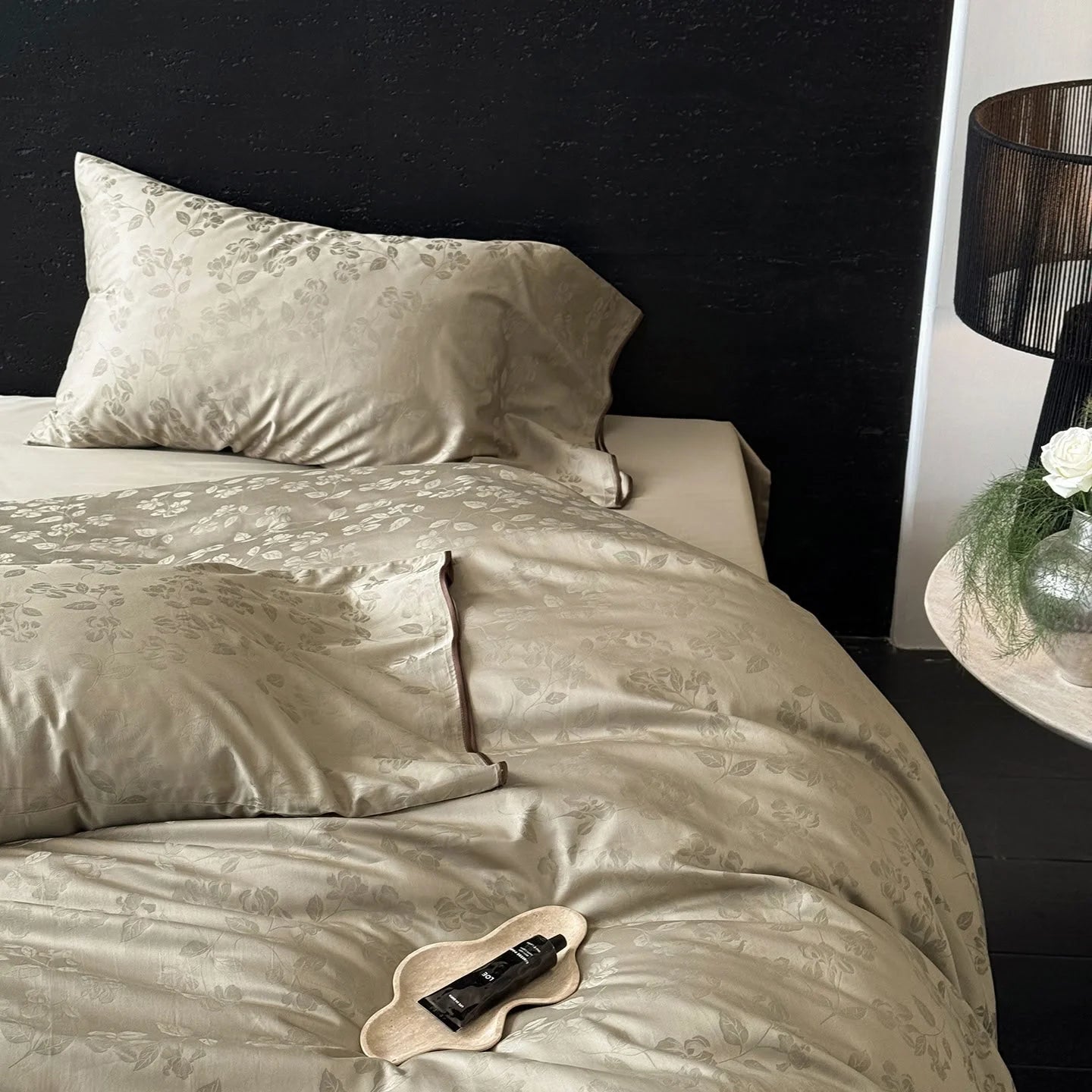 Angled view of the Khaki Green jacquard Tencel duvet cover and pillowcase, showing its lustrous finish.