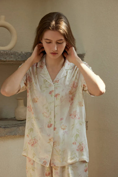 RoomDen Light Academia Style Pajama - Model adjusting collar in warm natural light