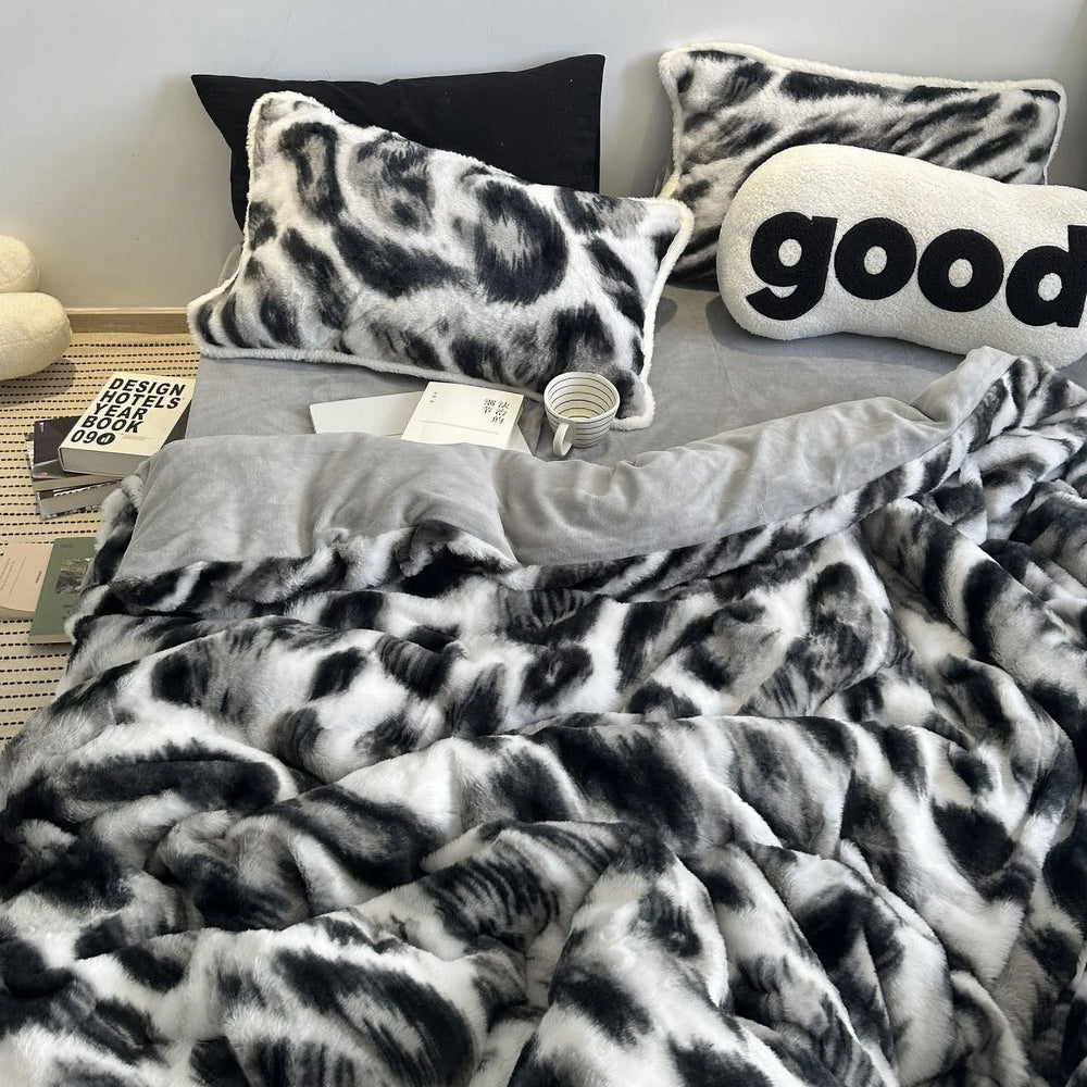 Full view of the plush black and white abstract print flannel fleece bedding set on a bed, styled with a "good" pillow. - RoomDen