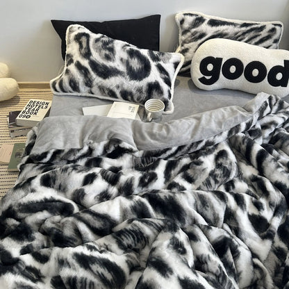 Full view of the plush black and white abstract print flannel fleece bedding set on a bed, styled with a "good" pillow. - RoomDen