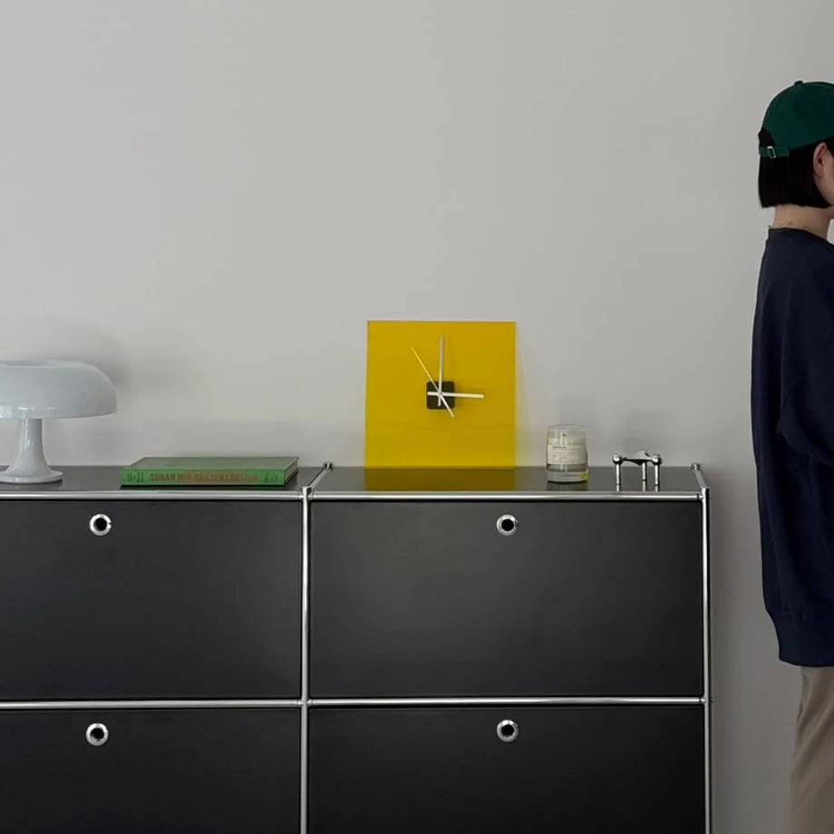 Sleek Solid Color Acrylic Table Clock in Zesty Yellow on a black modern cabinet. - RoomDen