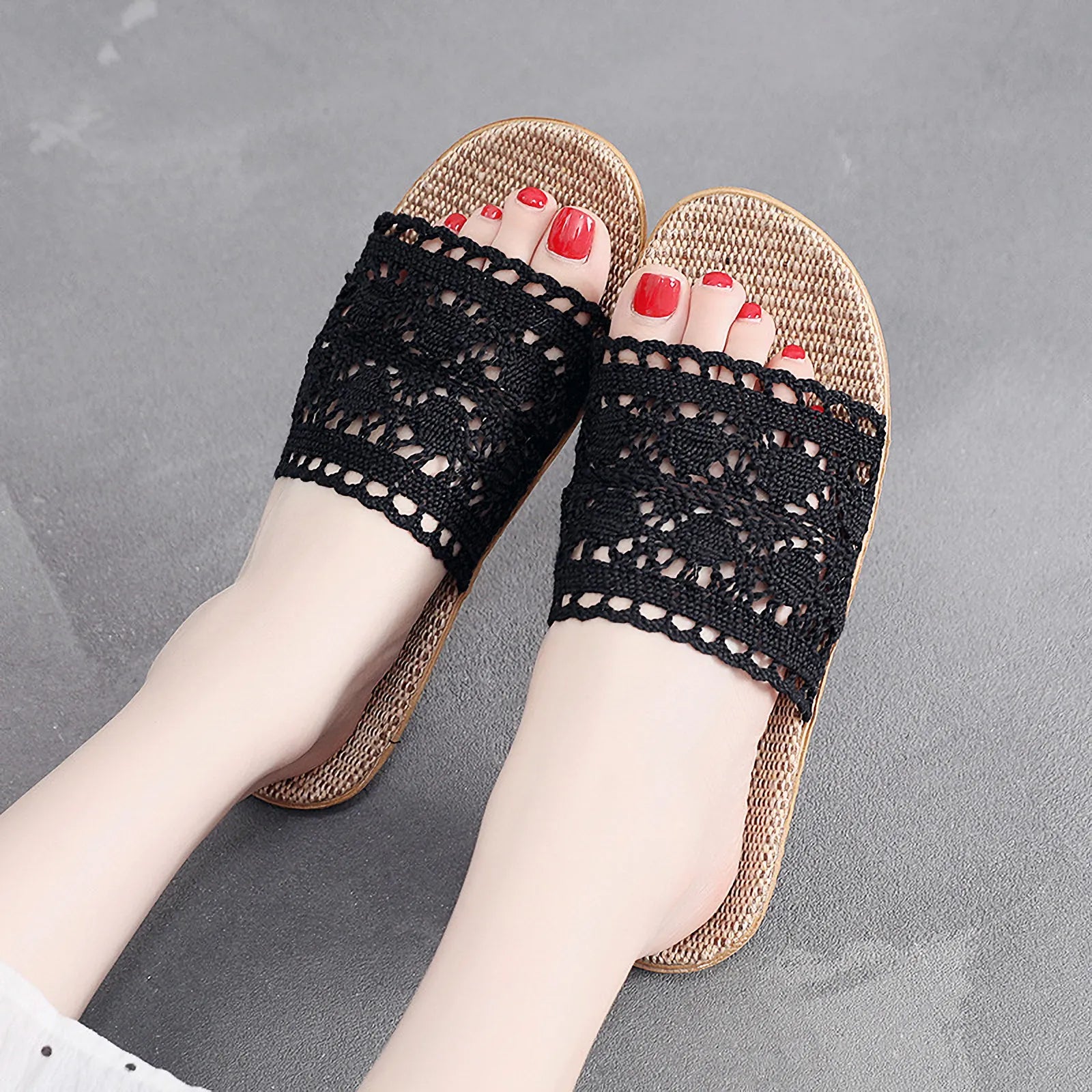 Model wearing white floral lace slides with woven straw sole - RoomDen