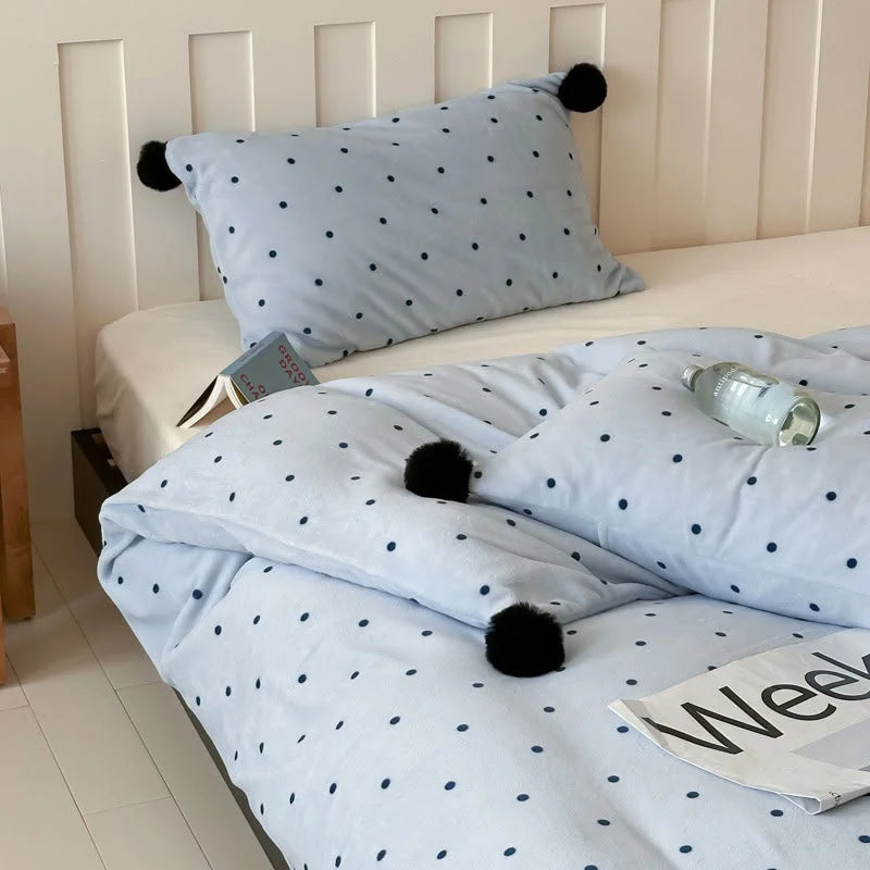 Angled shot of the Baby Blue Polka Dot Velvet Bedding Set, highlighting the duvet cover and matching pillow sham. - RoomDen