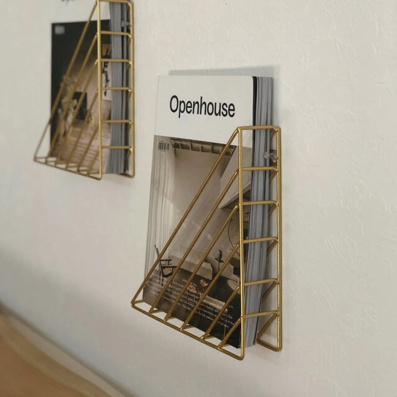 Side view of magazines stored neatly in the slim wall-mounted reading rack - RoomDen