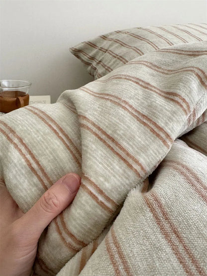 Hand Feeling the Texture of Beige Pinstripe Flannel Fleece Fabric