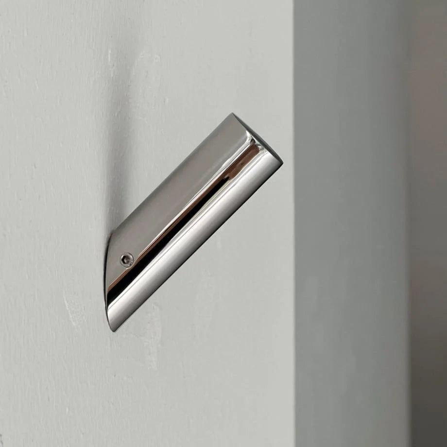 Detailed shot of the polished chrome finish on the industrial-style metal wall hook. - RoomDen