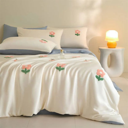 Side profile of the bed dressed in the White & Sky Blue Tufted Doodle Flower Tencel Bedding Set. - RoomDen