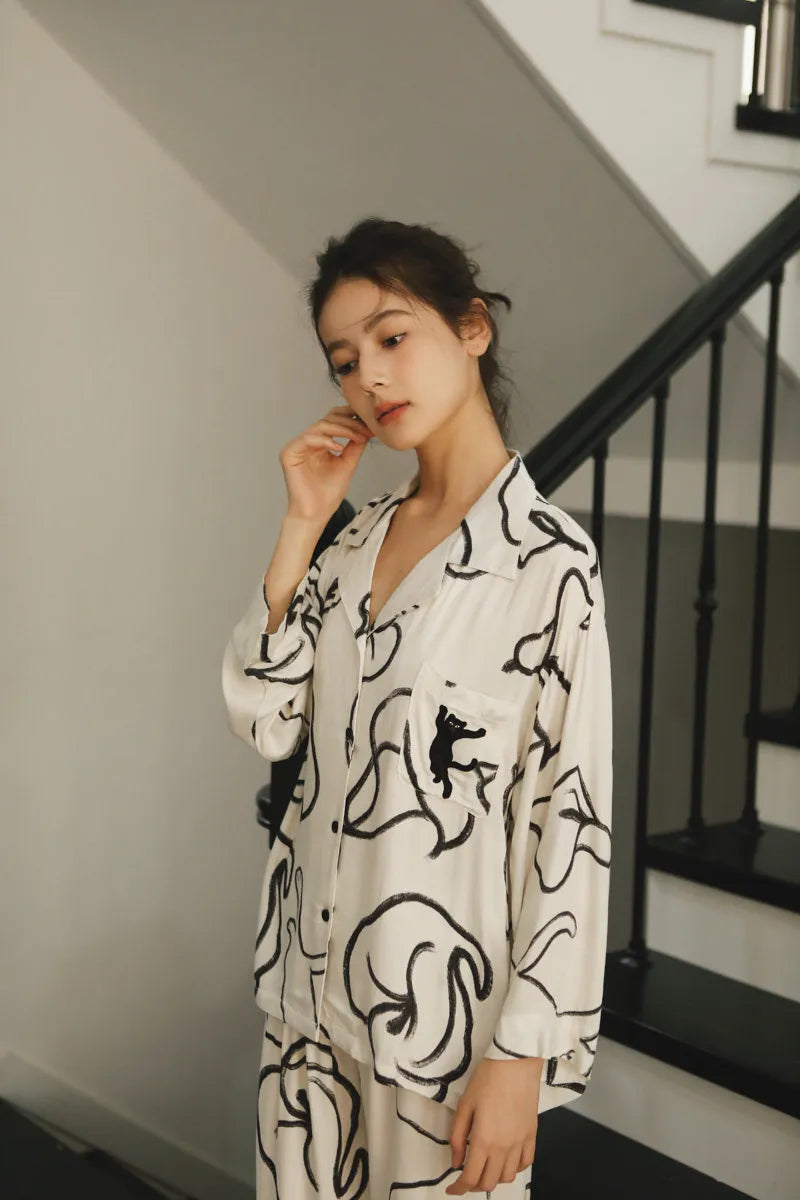 Close Up of Embroidered Black Cat on Pajama Pocket - RoomDen