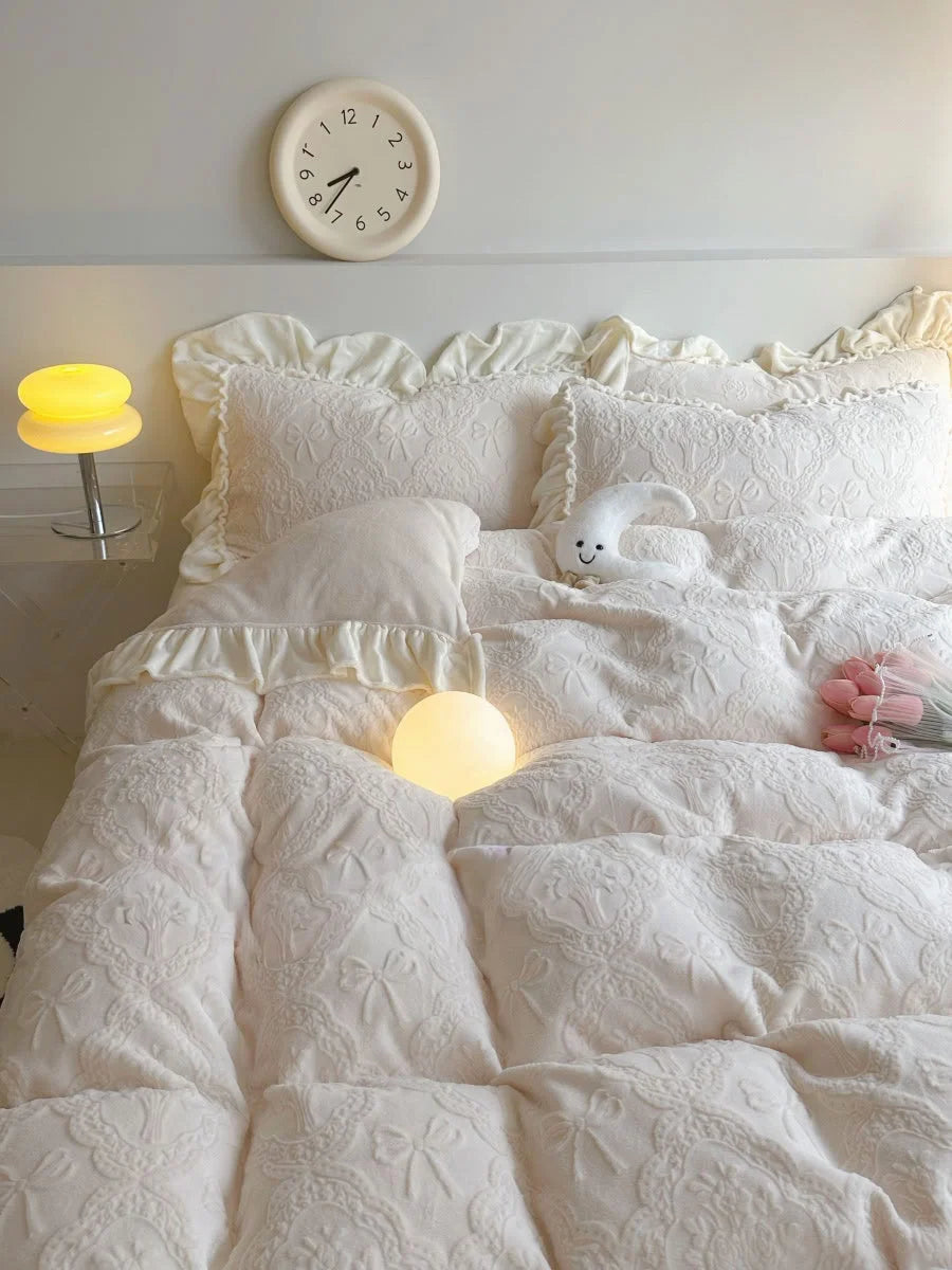 Full view of the Creamy Beige Ruffled Embossed Bow Bedding Set with a modern clock and lamps in a bright bedroom - RoomDen.