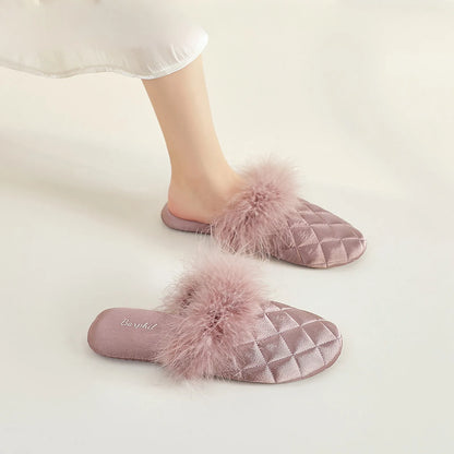 Mauve purple quilted satin slides with plush fur detail on legs