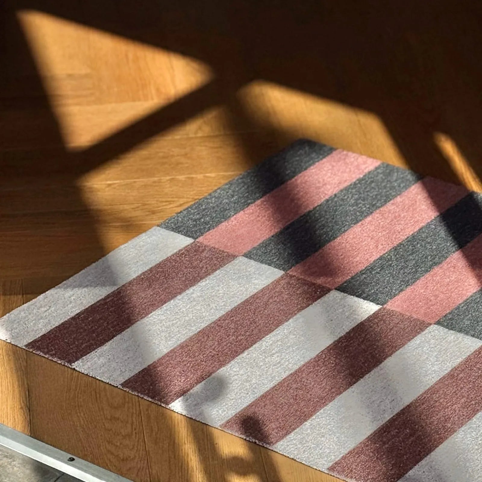 High traffic commercial grade coil mat in abstract pink and grey design - RoomDen