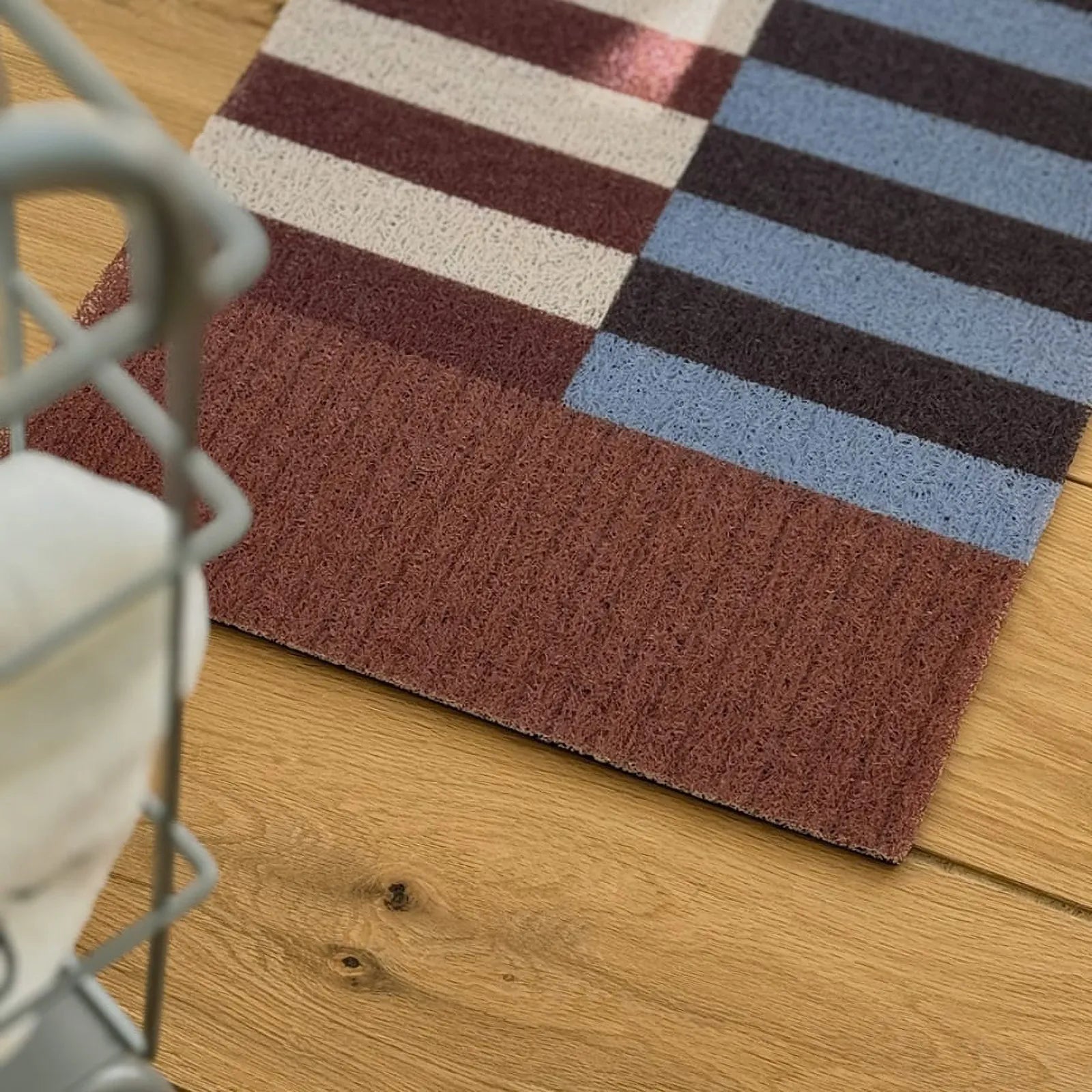 Close up texture of durable wire loop entry mat in burgundy and blue - RoomDen