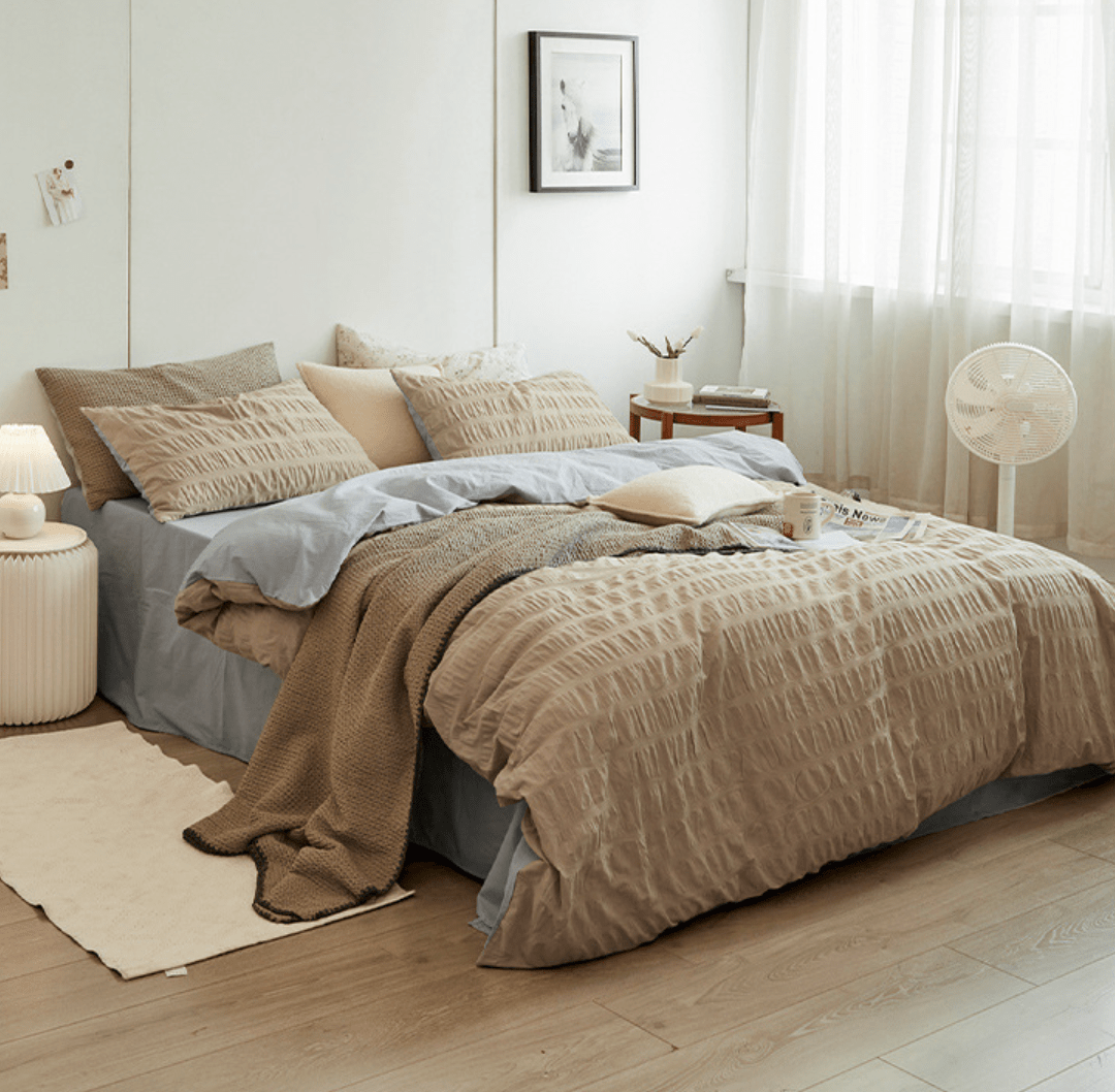 Marlon Seersucker Cotton Bedding Set – khaki bedding viewed from the side beside a window - Roomden