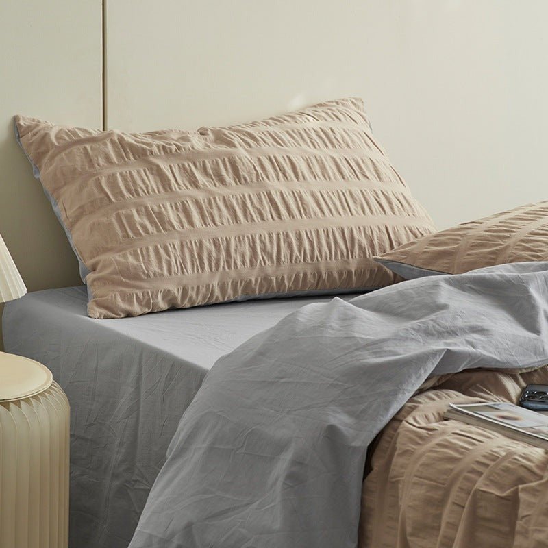 Marlon Seersucker Cotton Bedding Set – khaki pillow and folded duvet showing raised fabric texture - Roomden