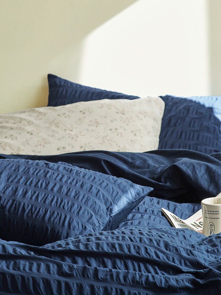 Marlon Seersucker Cotton Bedding Set – close view of navy seersucker texture and duvet folds - Roomden