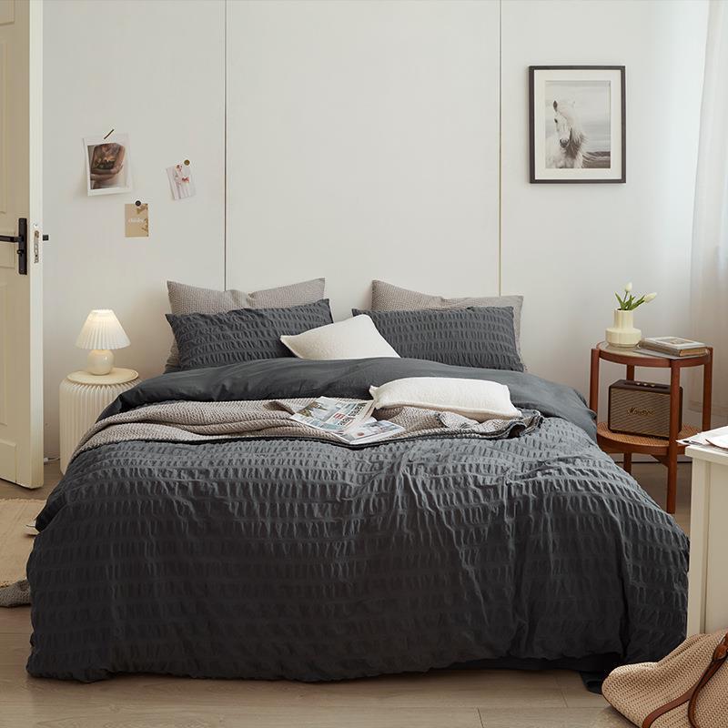 Marlon Seersucker Cotton Bedding Set – full slate-grey bed with a plain reverse turned back - Roomden