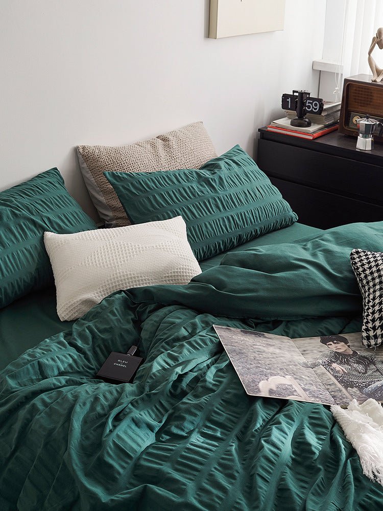 Marlon Seersucker Cotton Bedding Set – forest-green duvet turned back beneath a plain pillow - Roomden