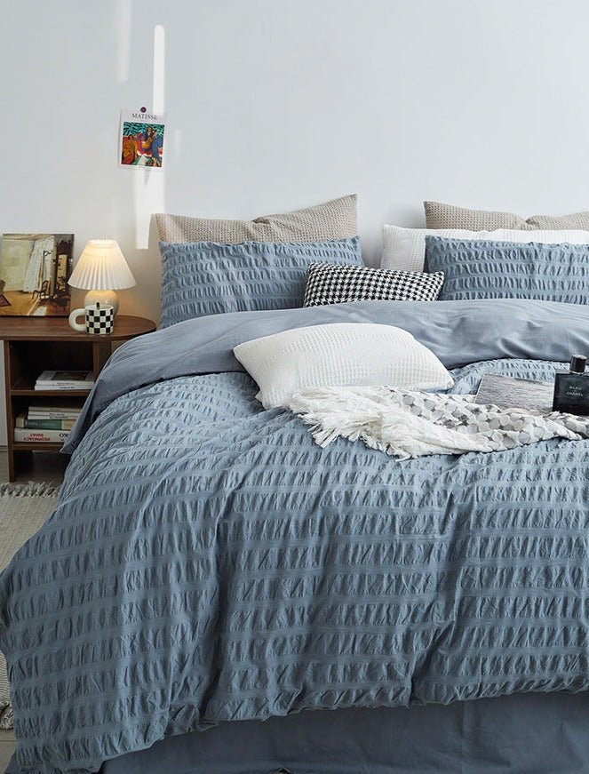 Marlon Seersucker Cotton Bedding Set – dusty-blue bed with textured duvet and matching pillows - Roomden