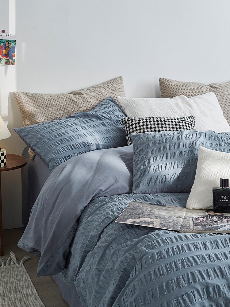 Marlon Seersucker Cotton Bedding Set – close view of dusty-blue textured pillows and duvet - Roomden