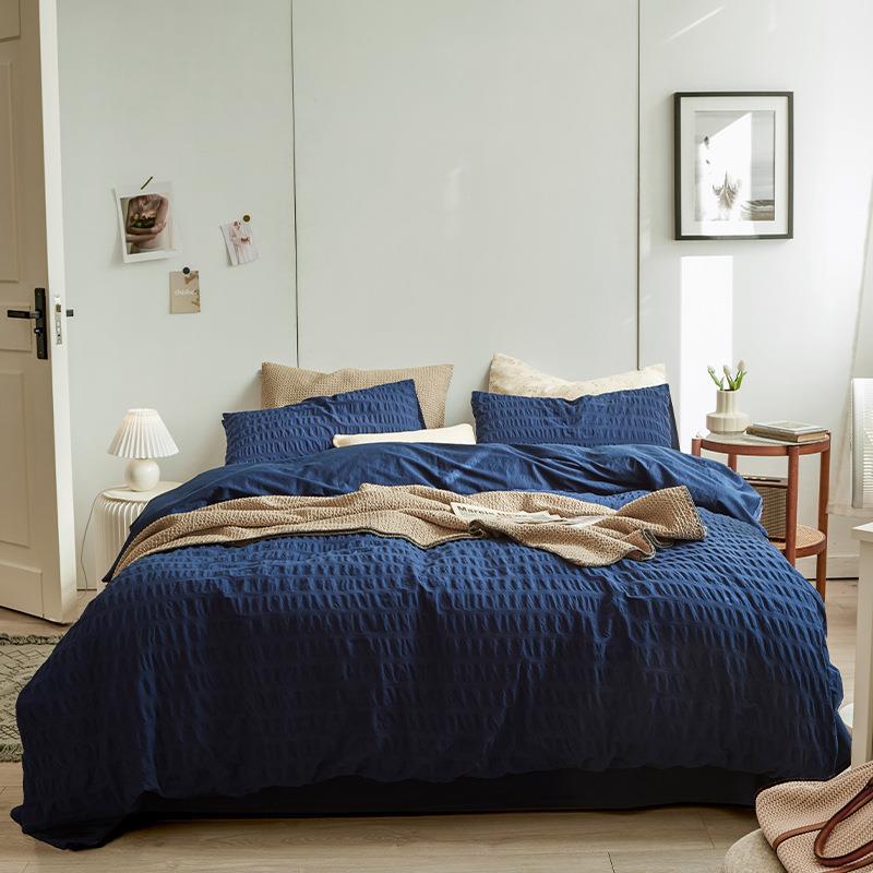 Marlon Seersucker Cotton Bedding Set – full navy bed with matching textured pillows - Roomden